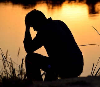 Trauma impacts pet loss and grief support. Image of man in trauma