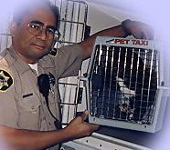 Trauma impacts pet loss and grief support. Image of humane Officer and shelter animal